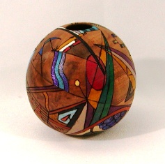 Hollowed, drawn, wood-burned, painted, and inked